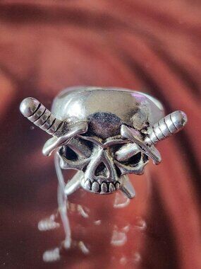 Silver stainless steel skull & dagger/swords ring. Size 8.5.